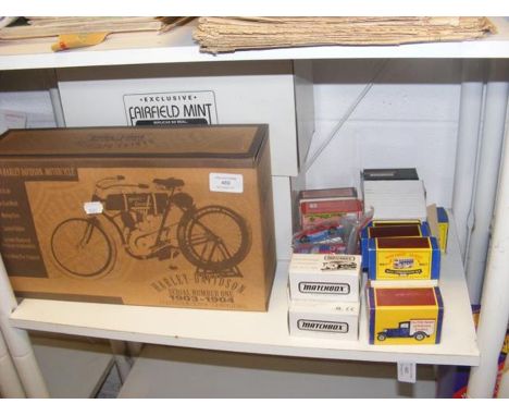 An assortment of die cast model Matchbox vehicles in boxes, together with a boxed replica Harley Davidson, etc. 