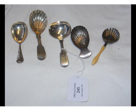 Four antique silver caddy spoons and one other