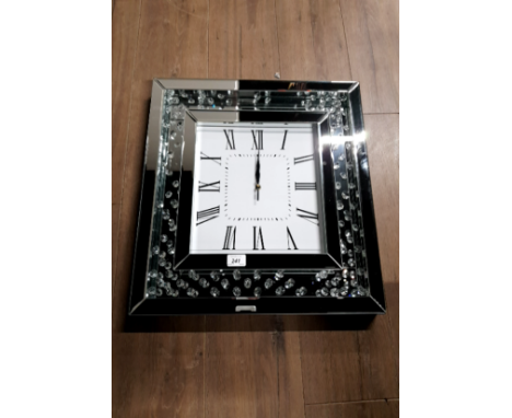 A MODERN SQUARE WALL CLOCK WITH GLASS AND CRYSTAL EFFECT SURROUND