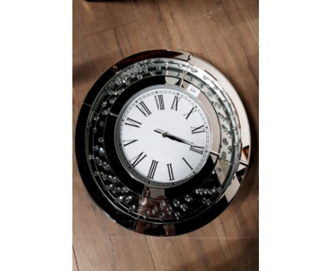 A MODERN GLASS AND CRYSTAL EFFECT WALL CLOCK