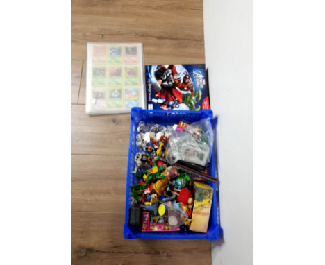 A LOT CONTAINING POKEMON CARDS HARRY POTTER COINS AND A VARIETY OF FIGURED TOYS
