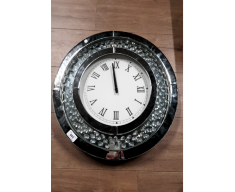 A MODERN CIRCULAR WALL CLOCK WITH GLASS AND CRYSTAL EFFECT MIRROR