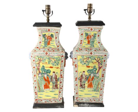A pair of Chinese porcelain square-section table lamps, with painted enamel panels and lion ring handles, height excluding fi