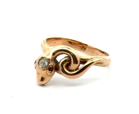 A snake ring set with a diamond in the head and ruby eyes, size P. Unmarked yellow gold tests as 14ct using XRF.