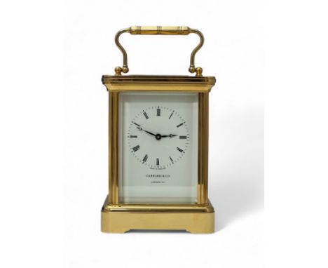 Garrard &amp; Co. 20th century brass four glass carriage clock, the dial bearing Roman numerals, marked for Garrard &amp; Co,