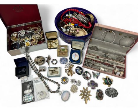 A quantity of silver and costume jewellery. Includes 2 silver bangles, silver rings, bracelets, earrings etc, a very long whi