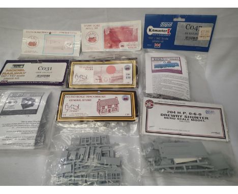 Seven Dapol plastic kits including; Railbus, Drewry shunter, general store, shop and flat, fencing, telegraph poles, wagon et