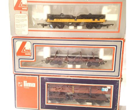 Three Lima bogie carrier wagons, all with different loads. P&amp;P Group 1 (£14+VAT for the first lot and £1+VAT for subseque