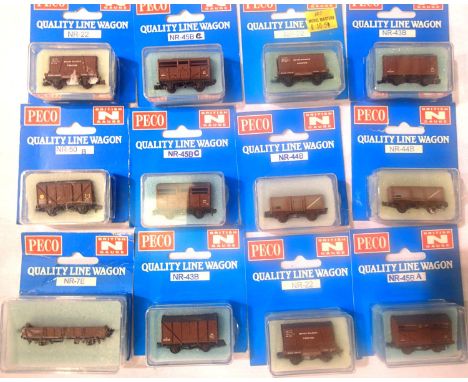 Twelve Peco N gauge BR related wagons; conflat, mineral, cattle, box van etc, in excellent condition, boxed. P&amp;P Group 1 