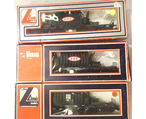Three Lima OO scale bogie wagons with transformer loads, Phillips and GEC x2. P&amp;P Group 1 (£14+VAT for the first lot and 