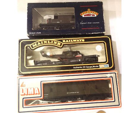 Three OO wagons; Bachmann Queen Mary brake van, Lima Air Compressor van and Mainline Well Wagon with helicopter. P&amp;P Grou