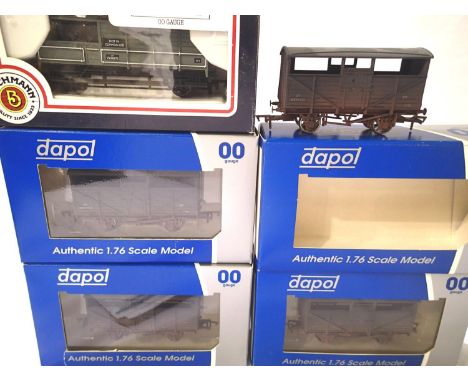 Four Dapol 8 ton cattle wagons (weathered) B893784, B893792, B893771, B893779 and a Bachmann 20T brake van BR Grey. P&amp;P G