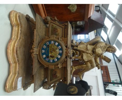 A 19th century gilt metal French mantel clock with a gentlemen reading and hand-painted animals inc a monkey, cat, dog & bird