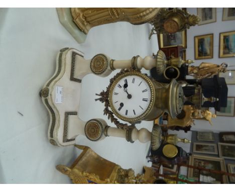 A 19th century alabaster & gilt metal French mantel clock: mounted on two columns with leaf, berry and rosette decoration