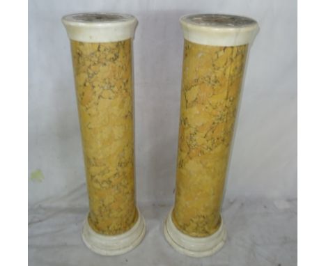 A pair of 19th century marble-style pedestals on ceramic bodies
