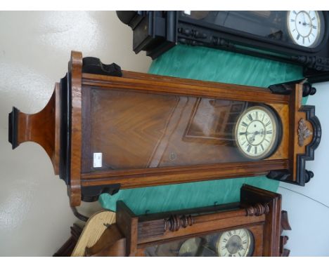A 19th century mahogany Vienna wall clock with enamel dial and acorn leaf decoration