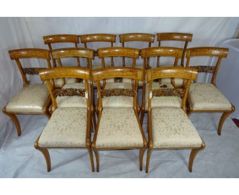 A set of twelve oak & holly dining chairs, circa 1845, by G J Morant: with carved rose and leaf splat, with roses applied to 