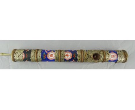 A Chinese porcelain opium pipe with white metal surround