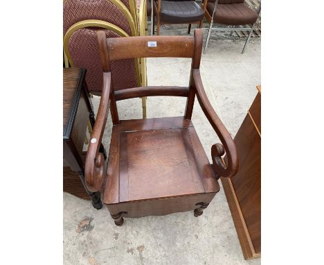 A MAHOGANY COMMODE WITH TURNED HANDLES 