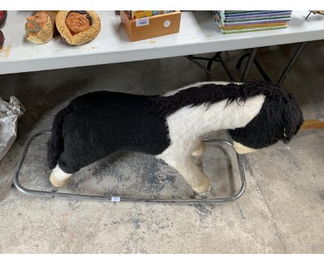 A VINTAGE SOFT TOY ROCKING HORSE 