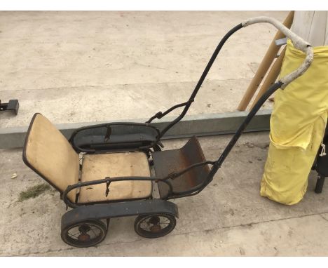 A VINTAGE PUSH CHAIR 