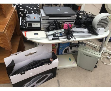 A LARGE COLLECTION OF ELECTRICALS TO INCLUDE A VINTAGE PROJECTOR, CD AND VIDEO PLAYERS, SHREDDER, A MASSAGE UNIT, FAN ETC 