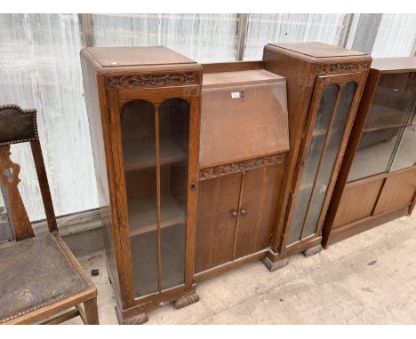 AN OAK BUREAU BOOKCASE WITH FALL FRONT, TWO DOORS AND TWO GLAZED PANEL SIDE DOORS 