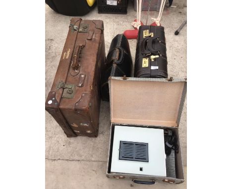 A VINTAGE SUIT CASE, TWO BRIEF CASES AND A VINTAGE PROJECTOR IN A CARRY CASE 