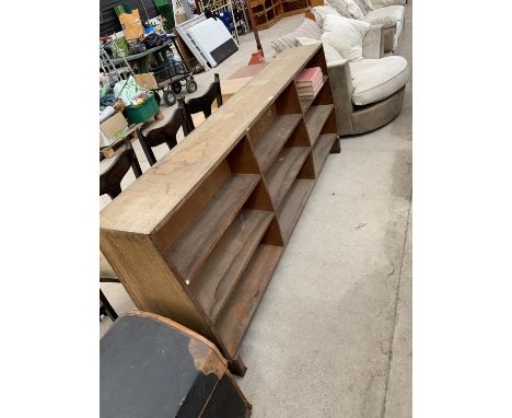 A VINTAGE PINE DOUBLE SIDED BOOKCASE AND BOOKS 