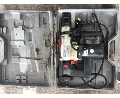 A PERFORMANCE ROTARY HAMMER DRILL IN CASE IN WORKING ORDER 