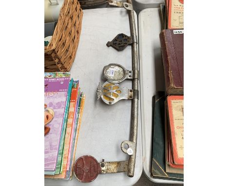 A VINTAGE METAL BAR WITH VARIOUS CAR BADGES 'AA' ETC 