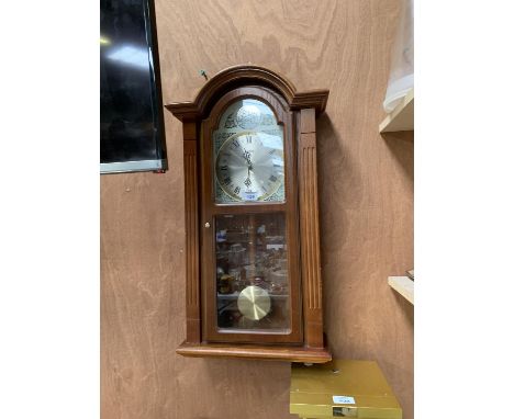 A MODERN WOODEN WALL CLOCK 