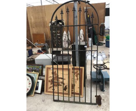 AN ORNATE WROUGHT IRON GATE 71 INCH X 31.5 INCH 