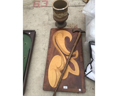 A WOODEN CARVED PICTURE A WOODEN WALKING STICK WITH CARVED PEACOCK HEAD AND A SMALL URN 