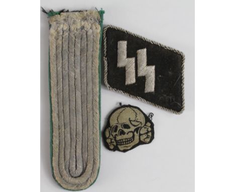 German SS collar tab, cloth skull and cross bones, and one epaulette  (3)   (No reserve)