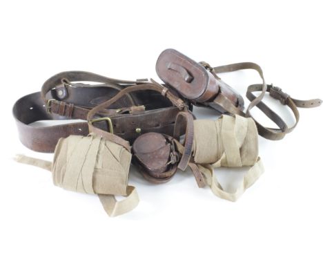 WW1 Officers puttees with Sam Brown, pair of binoculars in 1916 dated leather case and a WW1 pocket compass in leather case.