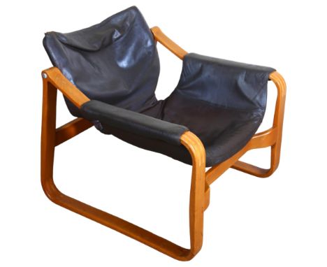 Maurice Prentice Burke, a rare leather lounge chair, the beech frame with sled base, with maker’s label, possibly a developme