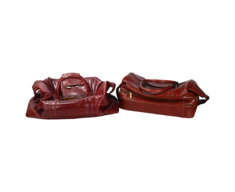 Jacob Fine Leather, a pair of burgundy leather weekend bags, one with original labelPurchased by vendor in Harrods, London.  