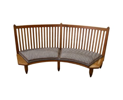Guillerme et Chambron, France, a 1960s curved oak bench sofa, length 198cm, depth approx 86cm, seat height 26cmWear and repai