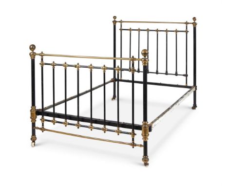 A VICTORIAN BLACK LACQUERED METAL AND BRASS BEDSTEAD LATE 19TH CENTURY Of tubular and turned form, with ceramic castors 137cm