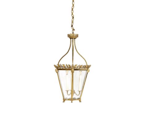 A REGENCY GILT METAL HALL LANTERN  CIRCA 1820 Of hexagonal tapering form, small paw feet  the lantern 76.5cm high to top of s