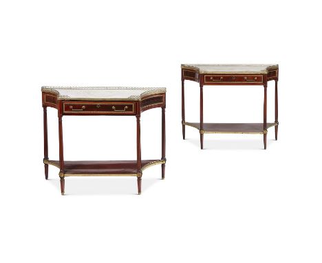 A PAIR OF DIRECTOIRE MAHOGANY, ORMOLU MOUNTED AND MARBLE TOPPED CONSOLE TABLES  CIRCA 1800  Each with an inset marble top abo