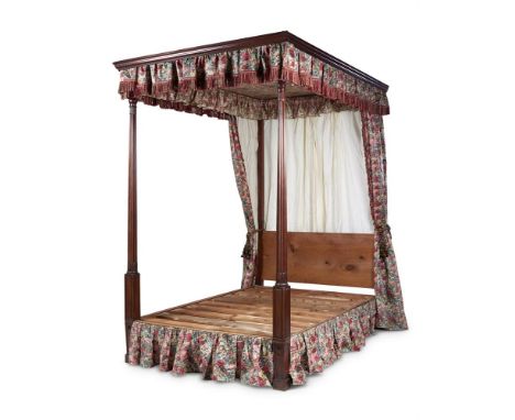 A MAHOGANY FOUR POSTER BED IN GEORGE III STYLE, 19TH CENTURY AND LATER With flower printed cotton hangings and Bullion trim a