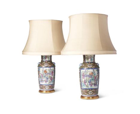 A PAIR OF CANTONESE EXPORT PORCELAIN FAMILLE ROSE VASES 19TH CENTURY with dog of fo handles 49cm high the vases circa 45cm hi