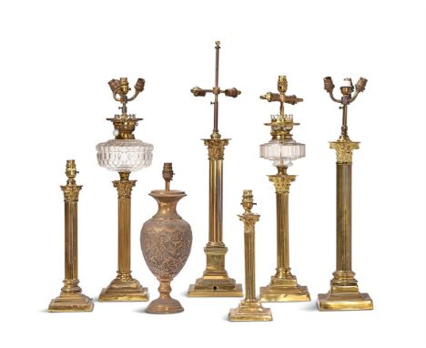 A GROUP OF SEVEN VARIOUS CORINTHIAN COLUMN TABLE LAMPS  LATE 19TH CENTURY AND LATER  to include a J. Lee lamp with glass rese