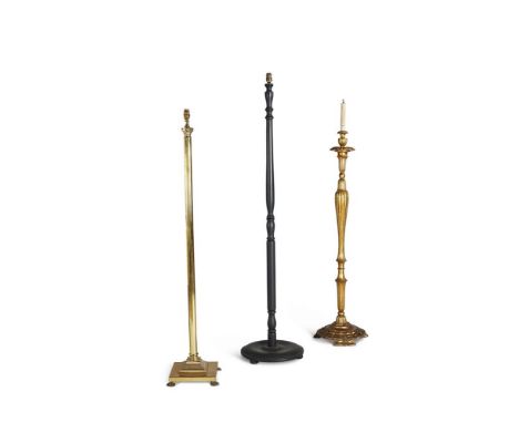A CARVED GILTWOOD STANDARD LAMP  20TH CENTURY  141cm high overall  Together with a brass standard lamp of columnar form, 136c