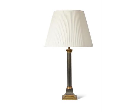 AN EBONISED AND GILT BRASS COLUMNAR LAMP BASE  20TH CENTURY  with fitment 66cm high, 99cm high to top of existing shade