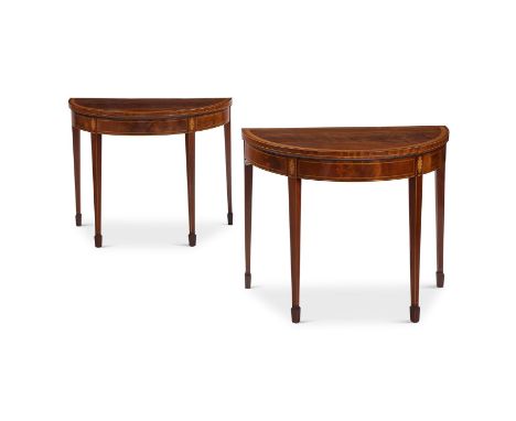 A PAIR OF GEORGE III MAHOGANY AND INLAID DEMI-LUNE CARD TABLES CIRCA 1790 The hinged tops enclosing baize playing surfaces ea