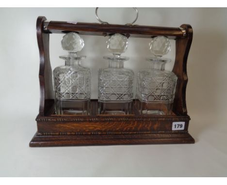Oak 1920s 3 Decanter Tantalus with Silver plated mounts           