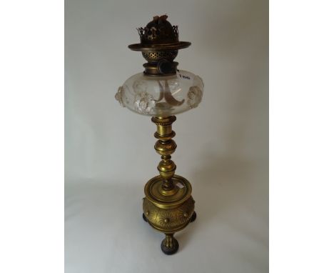 Late Victorian Oil Lamp with engraved decoration, glass reservoir with applied roundels all supported on paw feet   